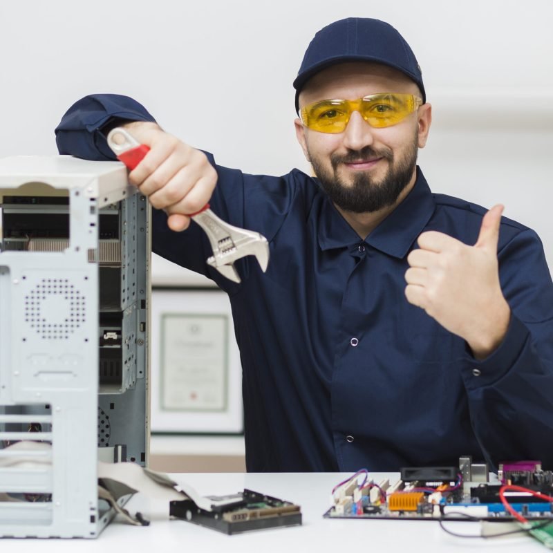 front-view-man-troubleshooting-computer